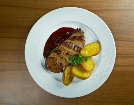 roast duck with potatoes.close upの写真素材