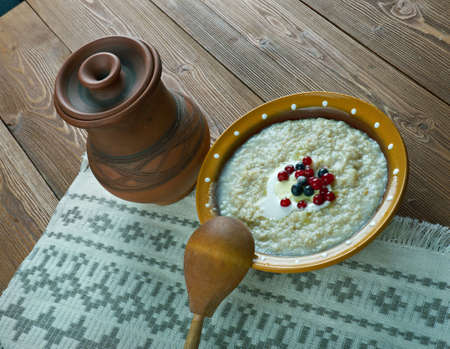 kaurapuuro  - oatmeal in the Finnish style with butter and berriesの写真素材