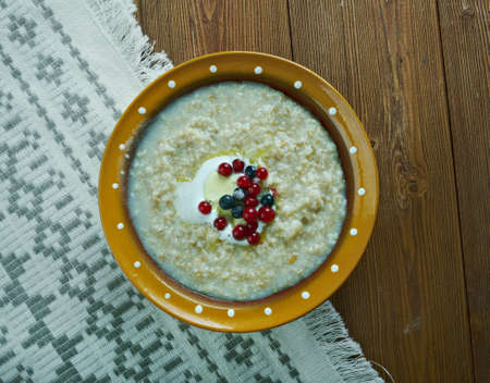 kaurapuuro  - oatmeal in the Finnish style with butter and berriesの写真素材