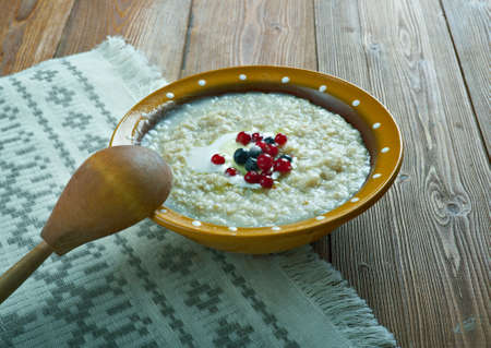 kaurapuuro  - oatmeal in the Finnish style with butter and berriesの写真素材