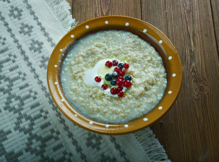 kaurapuuro  - oatmeal in the Finnish style with butter and berriesの写真素材