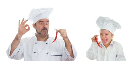 Playful Chef and and the little girl chef with chili isolated on white