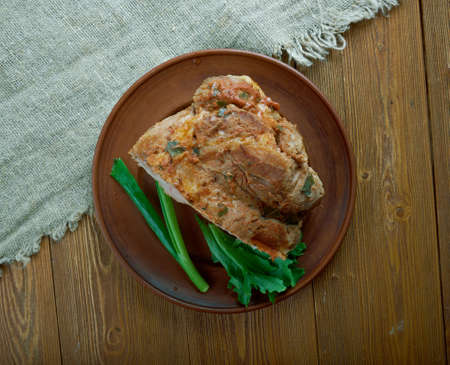 Kumpis - Lithuanian pork cooked ham.the old wooden background, selective focusの写真素材