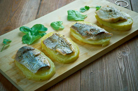 Patata con anguila al horno - Eel with baked potatoes.Spanish cuisineの写真素材