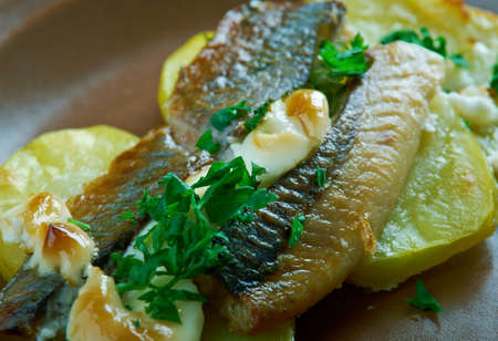Estonian Baked Herring with Potatoes. Baltic cuisine
