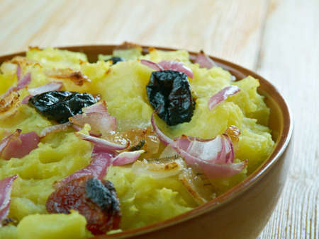 Belarusian casserole of potatoes, bacon and dried fruitsの写真素材