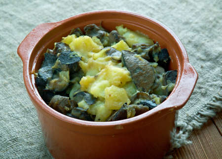 Mushroom Tushanka- Belarusian potato stew  on a wooden backgroundの写真素材