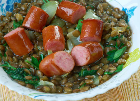 Lentilles vertes garnies - Sausage with green lentils. French cuisineの写真素材