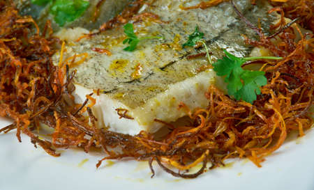 Hake with Bayonne Ham.  Pan-fry hake steaks in a bit of olive oil; set aside. In the same pan, fry the ham, mushrooms and peppers together.の写真素材