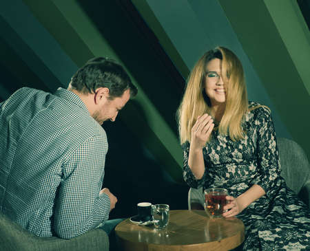 Happy couple in a coffee house having breakfastの写真素材