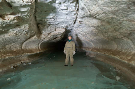 Girl speleologist. Cave in the Pinega region .Arhangelsk region