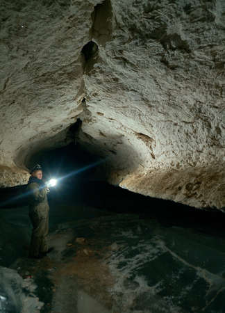 Girl speleologist. Cave in the Pinega region .Arhangelsk regionの写真素材