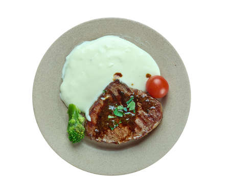 Vanillerostbraten - is an Austrian beef cutlet dish prepared with garlic, salt, pepper, butter, onions, and brown bouillonの写真素材