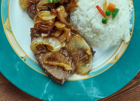 Bistec de Palomilla -  Cuban dish consisting of beef round steak marinated in garlic, lime juice, salt and pepper then pan-friedの写真素材