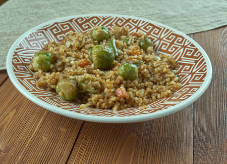 Freekeh - cereal food made from green durum wheat,Fried with vegetables.の写真素材