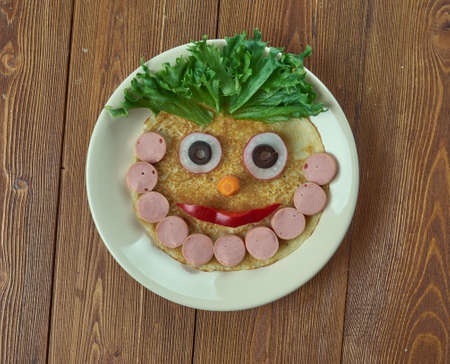 creative food concept -  bearded man made of pancake, sausages and vegetables. kids menu の写真素材
