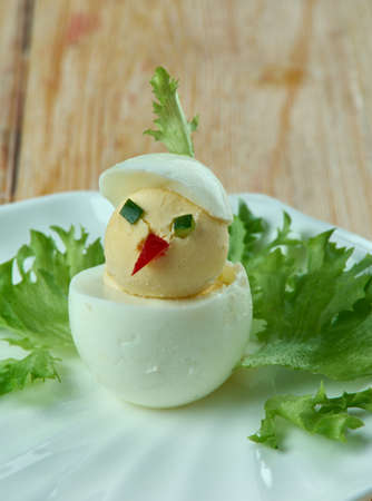 creative food concept  - chickens, made from eggs, sauce and vegetables. kids menu