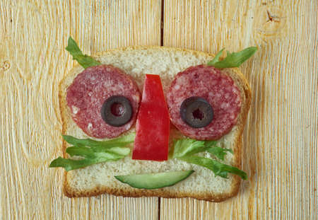 creative food concept  - Funny sandwich for kids  man made of Bread, toast, sausage, vegetablesの写真素材