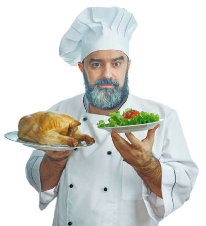 chief cook  holding  Fried chicken and vegetables. What to choose. isolated on white
