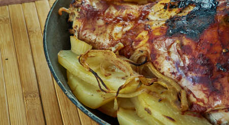 Baked rabbit with potatoes In  rustic style