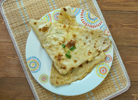 eka - Armenian snack from lavash, cheese with egg and greens.