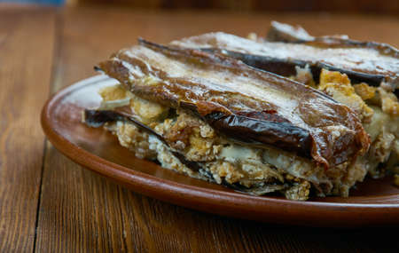 Greek moussaka with eggplant and feta cheese,  traditional Greek dish on plateの写真素材