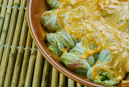 Indian stuffed  curry cabbage  with brown rice and vegetables - Bandh gobi ki rollsの写真素材