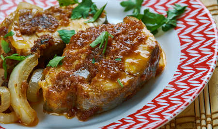 Kesari Fish Tikka - Tandoori baked fish chunks marinated with yoghurt, saffron and spices.の写真素材