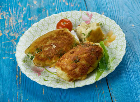 Chiftele de peste  - Fish balls with greens. Spanish cuisineの写真素材