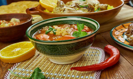 Arabian cuisine - Shurba Omani, Omani Vegetable Soup, Traditional assorted  dishes, Top view.