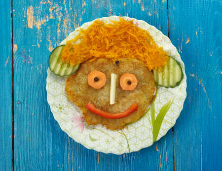 creative food concept -  Funny potato fritters for kids
の写真素材