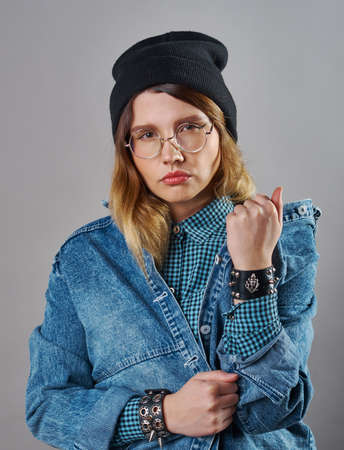 young pretty glasses fair-haired teenage hipster girl emotional posing ,  lifestyle people concept
