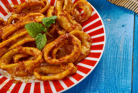 Indian cuisine . Kerala Style Kanava - Squid Roast, Traditional assorted India dishes, Top view.の写真素材