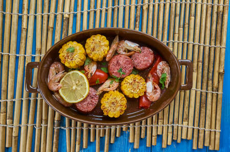Sheet Pan Shrimp Boil - Traditionally, you combine corn,  shrimp, sausage, seasoningsの写真素材