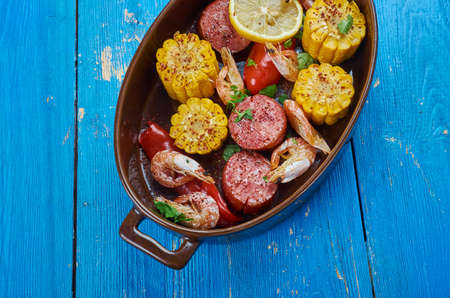 Sheet Pan Shrimp Boil - Traditionally, you combine corn,  shrimp, sausage, seasoningsの写真素材