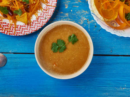 Moroccan cuisine, Carrot Red Lentil Soup, Traditional assorted Moroccodishes, Top view.