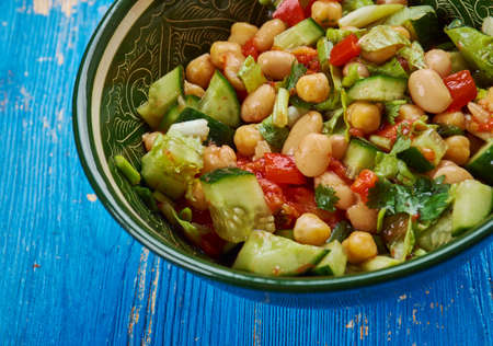 Balela - Middle Eastern-style bean salad, made with garbanzo and black beans, plus lots of sweet grape tomatoesの写真素材