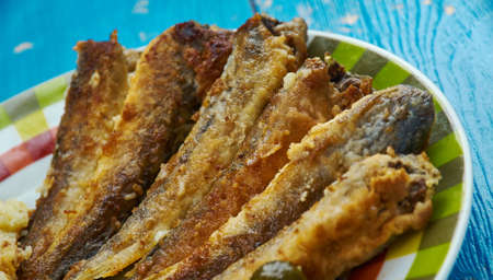 Fried navaga , Fried fish with vegetable garnish.の写真素材