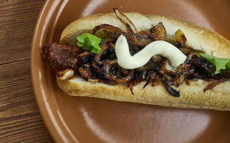 Caramelized Beer Onions and Cheddar Bratwurst close upの写真素材