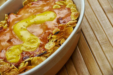 Oven Baked Frito Chili Pie, Sprinkle about half the shredded cheese atop the Fritosの写真素材