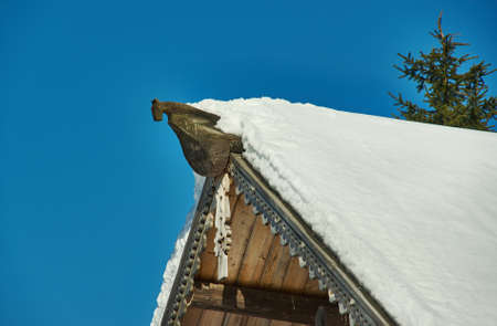 Russian Traditional wooden architecture - Chudsky konek , Top log on the roof of the houseMalye Karely village, Arkhangelsk region, Russiaの写真素材