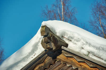 Russian Traditional wooden architecture - Chudsky konek , Top log on the roof of the houseMalye...