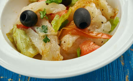 Esqueixada - traditional Catalan dish, a salad of shredded salt cod, tomatoes, onions, olive oil and...