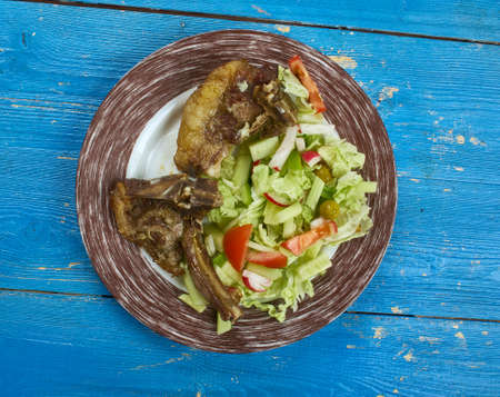 Peshwari lamb kebab, grilled lamb chops marinated with raw papaya, garlic, ground chilli, fennel and...
