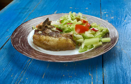 Peshwari lamb kebab, grilled lamb chops marinated with raw papaya, garlic, ground chilli, fennel and...
