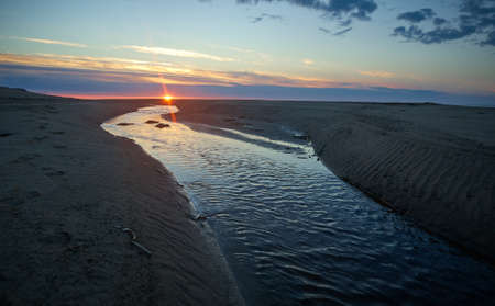 Sunset White Sea, Russia .Sandy shore of the south coast