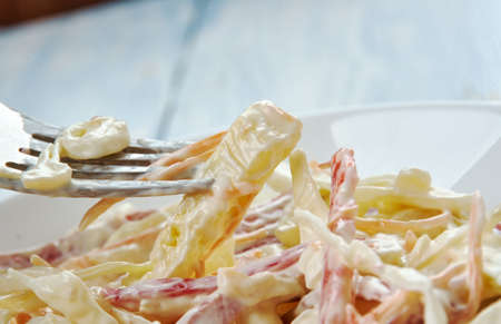 Insalata capricciosa - classic Italian salad, rispy salad leaves with cubed bell peppers, celery root, ham and cheese and everything is dressed with a creamy mayo-yogurt sauceの写真素材