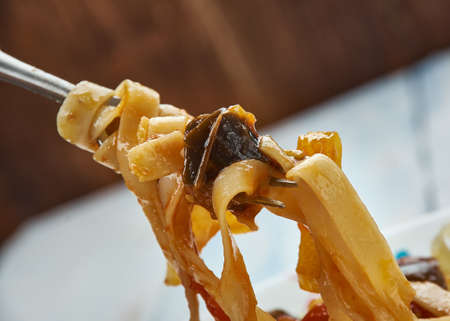 Fettuccine with tomato eggplant sauce, close up