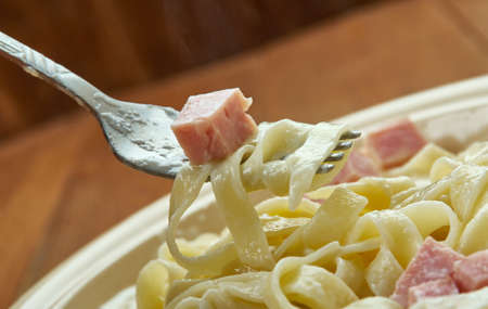 Fettuccine Alfredo - type of pasta popular in Roman and Tuscan cuisine.の写真素材