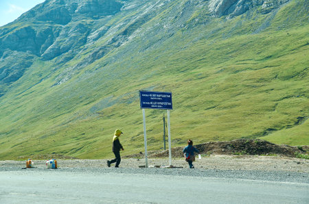Taldyk Pass, 3615 m, Pamir Highway, Kyrgyzstan, Children merchants August 2, 2018のeditorial素材